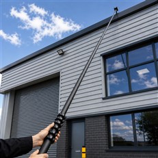 Against a commercial building